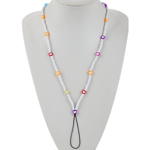 Colorful handmade beaded heart phone lanyard on white bust display for fashion