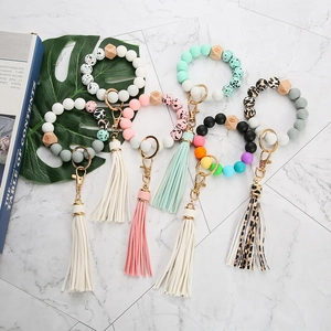 Silicone bead keychain bracelets with PU leather tassels in leopard and marble prints