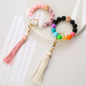 Silicone bead keychain wristlet with faux leather tassel and leopard print charms