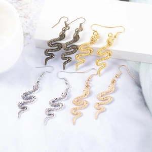 Bohemian style bronze and silver snake earrings with detailed scale texture and S-shaped curves