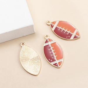 Rugby ball alloy pendant with brown gradient drip oil finish and metallic texture