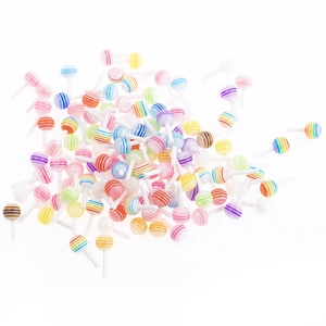 Colorful resin lollipop charms for DIY jewelry and nail art accessories on white background