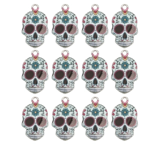 Set of 12 colorful Day of the Dead skull charms with floral enamel details for DIY jewelry