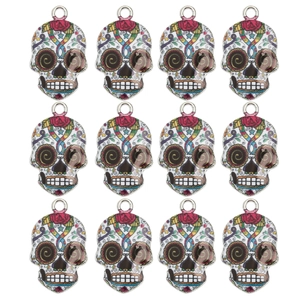 Set of 12 colorful Day of the Dead skull charms with enamel flower details for DIY jewelry