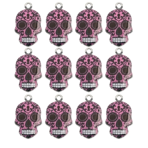 Detailed set of 12 colorful Day of the Dead enamel skull charms with floral patterns