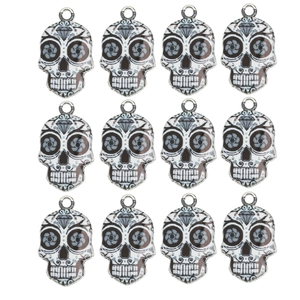 Set of 12 sugar skull charms for DIY jewelry making featuring floral patterns