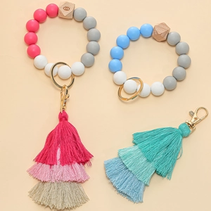 Silicone bead wristlet keychain with wooden evil eye bead and layered tassel
