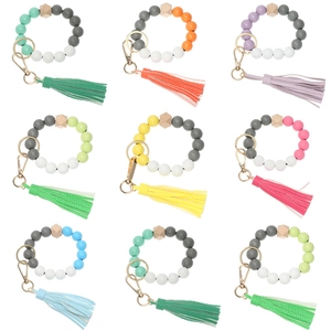 Silicone and wood bead keychain bracelet with leather tassel in nine diverse colors