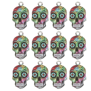 Detailed view of 12 colorful Day of the Dead skull charms for DIY jewelry making