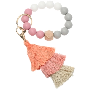 Detail of pink silicone beads and wooden hexagon bead with multi-layer tassel keychain