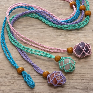 Handmade woven rope necklace with natural crystals in net pouches and wooden beads
