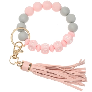 Close-up of pink and grey silicone beaded keychain with LOVE letters and leather tassel