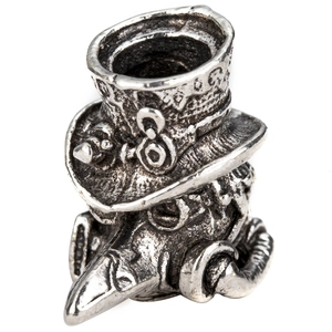 Macro detail of antique silver plague doctor bead with steampunk mask and top hat