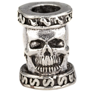 Close-up of vintage silver viking skull bead with large hole for DIY hair accessories
