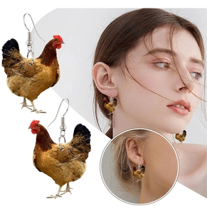 Detailed realistic hen earrings with brown feather textures and red crest on model