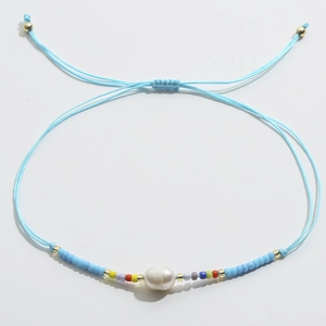 Bracelet bohème en cordon bleu ciel avec perle ovale et perles colorées mixtes