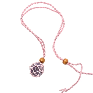 Detail of pink woven rope necklace with amethyst stone and natural wooden beads