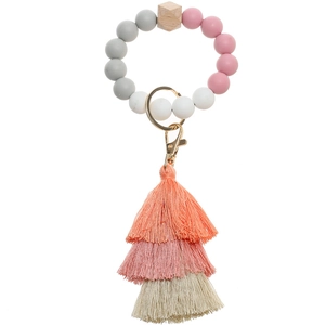 Macro view of multi-layer gradient tassel and food-grade silicone beads on keychain