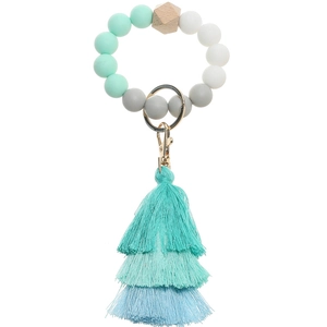 Macro detail of silicone beads and a three-layer gradient tassel on this keychain ring