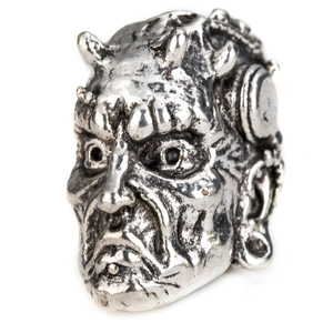Detailed view of Viking style silver alloy beads with antique devil head carvings