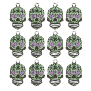 Set of 12 colorful skull charms with green enamel finish and purple heart eyes for DIY jewelry