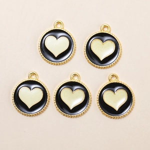 Five round alloy heart charms with gold gear edges and black enamel for DIY jewelry making