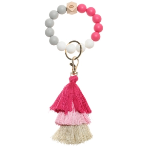 Detail of beaded keychain bracelet with silicone beads, wooden eye bead and layered tassel