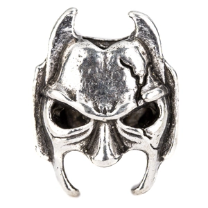 Detail shot of vintage silver metal Viking bead with cracked mask and skull design