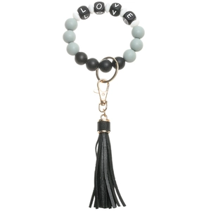 Detailed view of silicone bead keychain bracelet with LOVE letter and leather tassel
