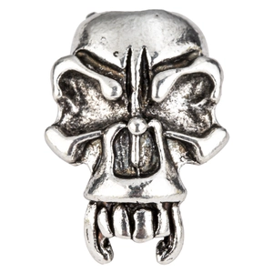 Detailed close-up of a vintage silver skull bead with tusks and aged finish for DIY jewelry