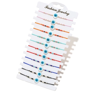 Détail du lot de 12 bracelets œil maléfique avec cordons réglables et perles colorées