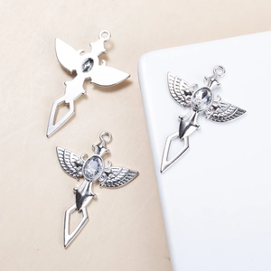 Set de colliers croix ailée en argent avec zircon clair, design gothique minimaliste