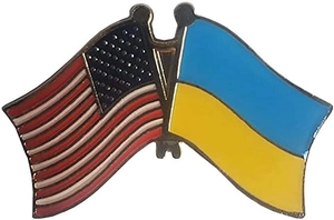 Macro shot of US and Ukraine crossed flags metal enamel lapel pin with gold plating