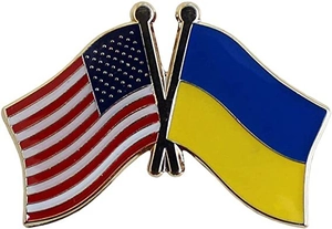 Detail of US and Ukraine crossed flags enamel pin with gold plating and butterfly clutches