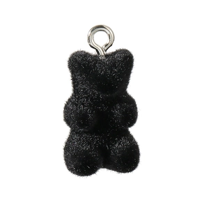 Close-up of black flocked mini bear pendant with silver metal ring for DIY jewelry making