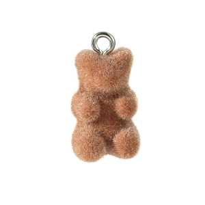 Macro detail of a brown flocked mini bear pendant with silver metal ring for jewelry DIY