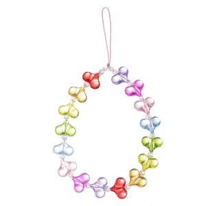 Detail of colorful rainbow heart beads on a transparent acrylic mobile phone charm strap