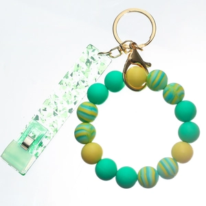 Detail of colorful silicone bead wristlet with sparkling green acrylic card grabber clip