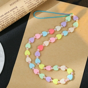 Colorful heart beaded phone strap with macaron resin beads and white pearls on kraft paper