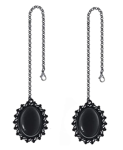 Detail of gothic oval black stone pendants with ornate frames and lobster clasp chains