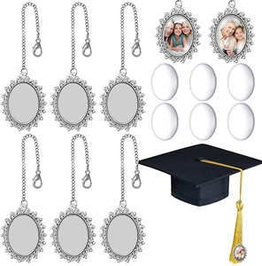Detail of DIY graduation photo charms with vintage silver bases and glass cabochons