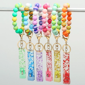 Rainbow silicone beaded wristlet keychains with gold clips and colorful glitter charms