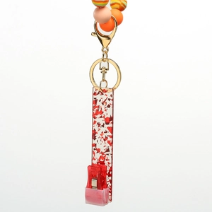 Colorful silicone beaded wristlet keychain with gold clasp and glittery red card holder