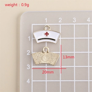 Detailed front and back view of white enamel nurse hat pendant with red cross and gold alloy