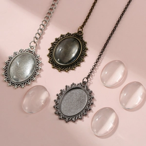 Detailed view of DIY alloy photo frame pendants with chains and clear resin cabochons