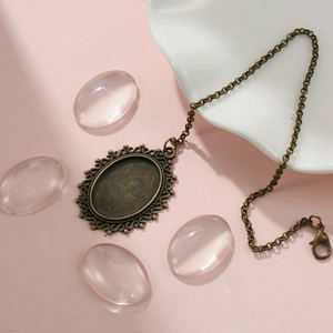 Macro view of vintage bronze alloy oval pendant with hollow details and resin covers