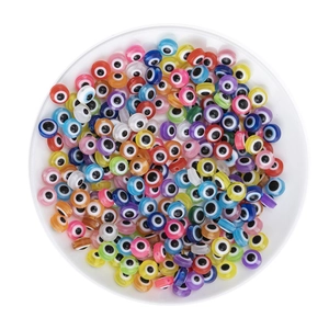 Close-up of mixed colorful resin flat round evil eye beads for DIY jewelry making