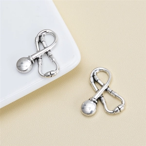 Macro detail of alloy stethoscope charms in vintage silver finish for DIY jewelry