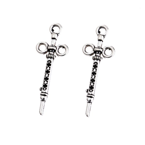 Detailed pair of alloy stethoscope syringe pendants with black and white zircon stones