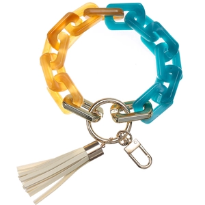 Detail of amber and turquoise acrylic chain bracelet keychain with cream PU tassel and gold clasp